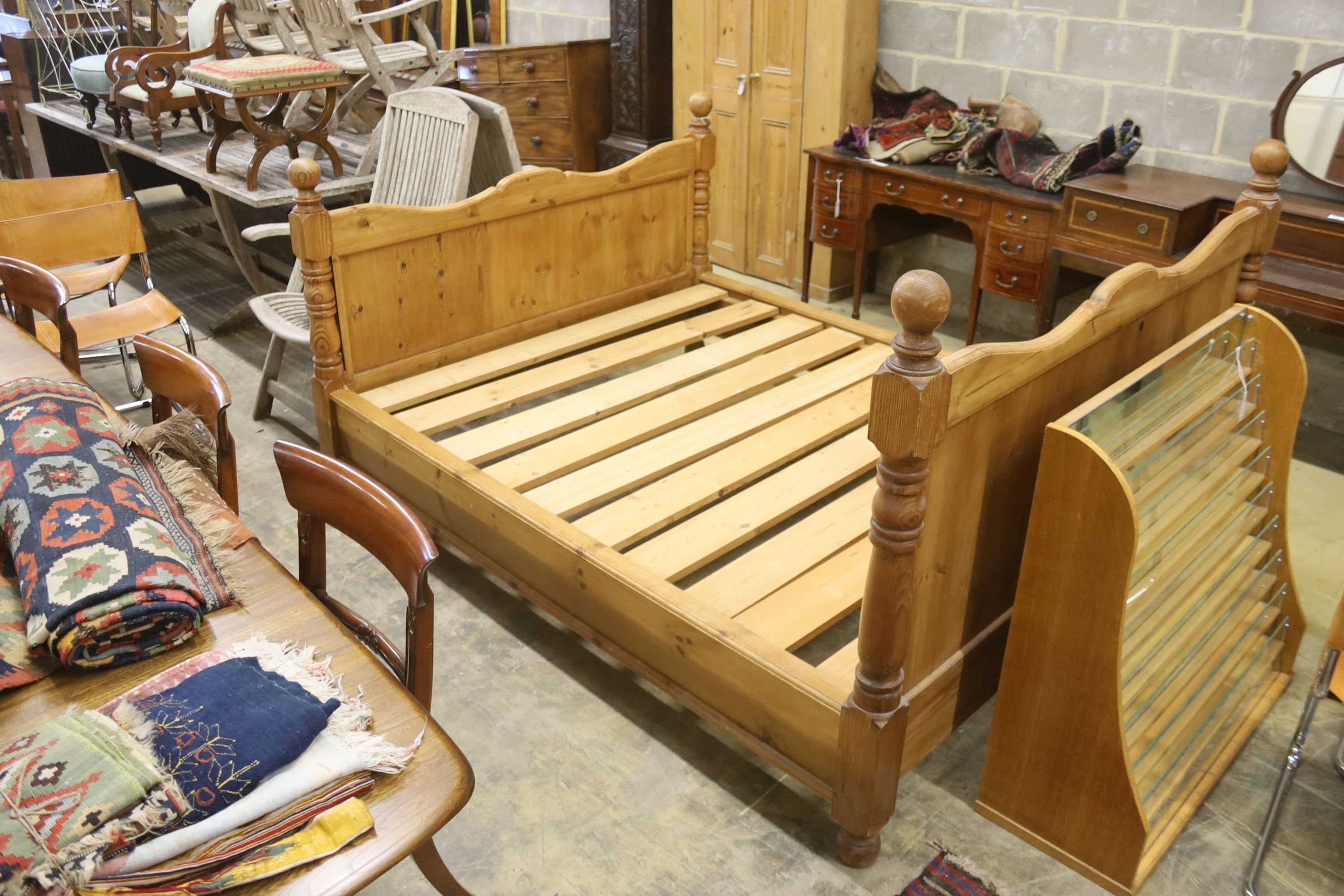 A king size pine bed frame with side rails and slats, width 170cm, length 213cm